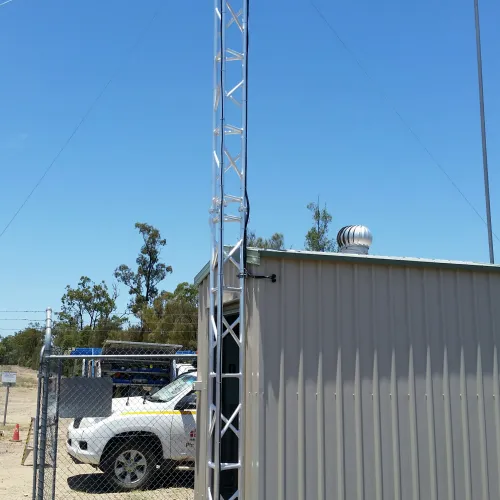 AL340 6m tower mounted to the side of a site donga