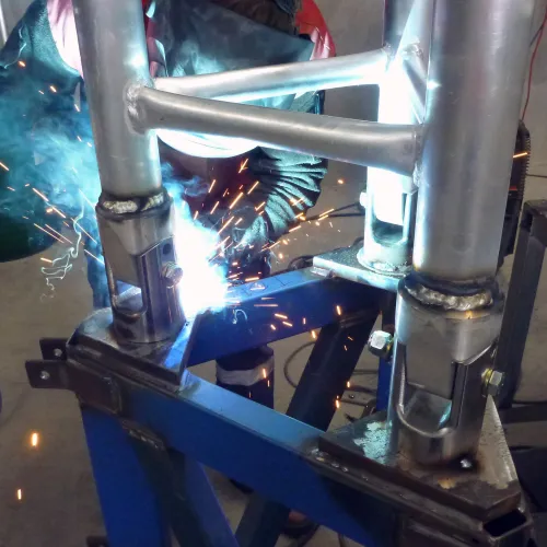 Welding hinges on the AL500 Tripod Tower